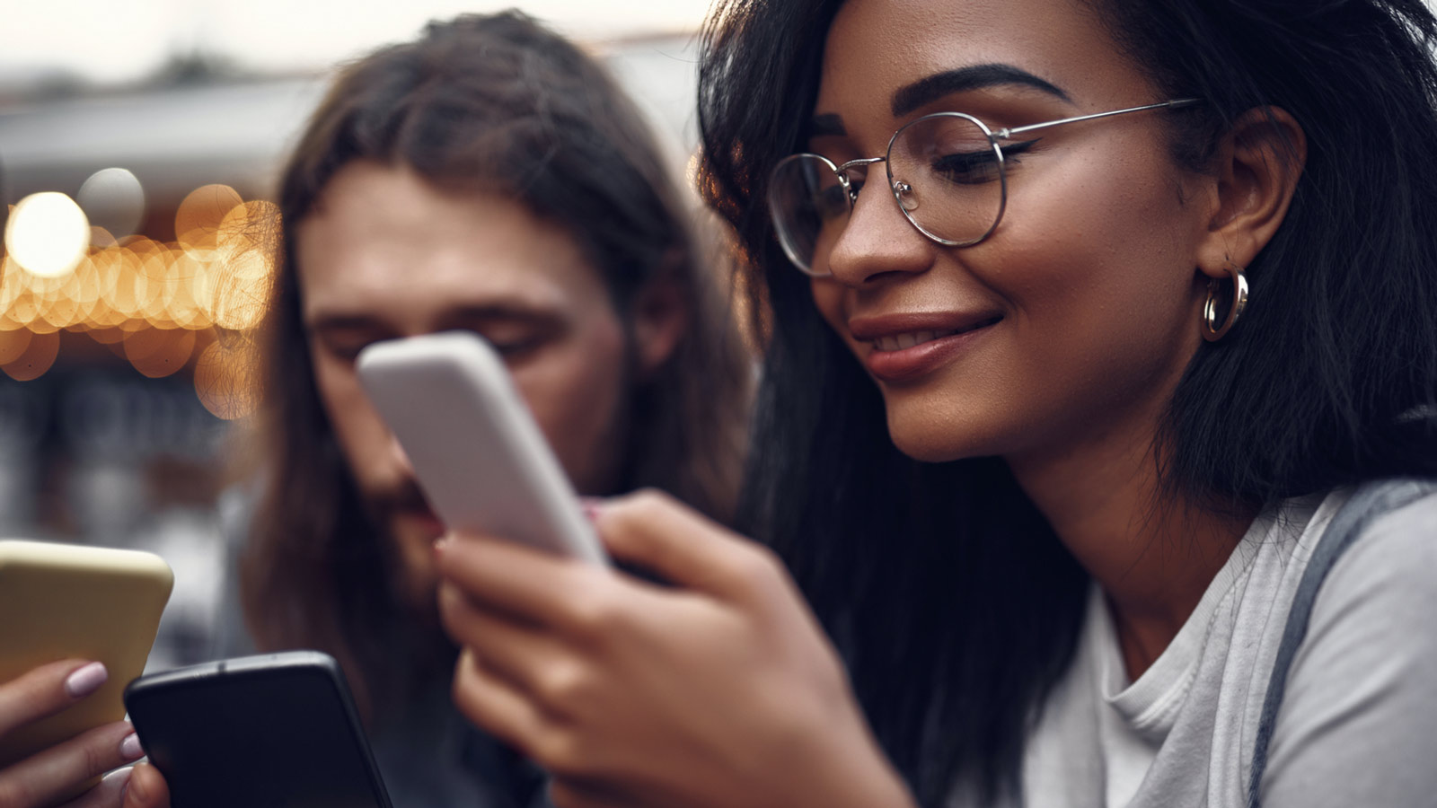 Smiling woman looking at her mobile