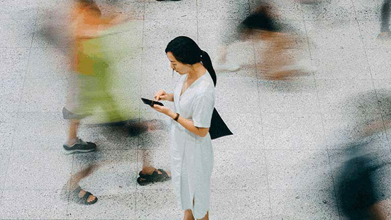 woman looking at her phone